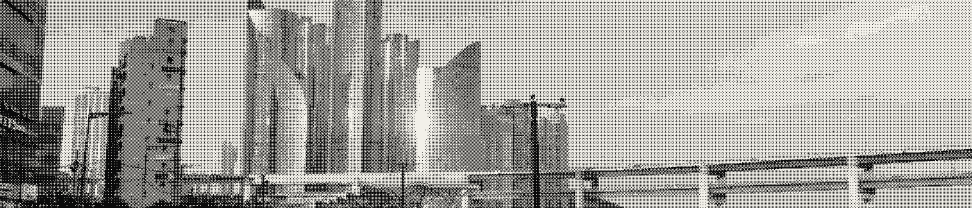 A seaside promenade at dusk, dithered to two tones.